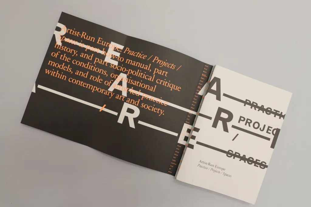 An image of a grey book with 'Artist-Run Europe' written in white and 'Practice, Project, Spaces' written in black on a white background. 