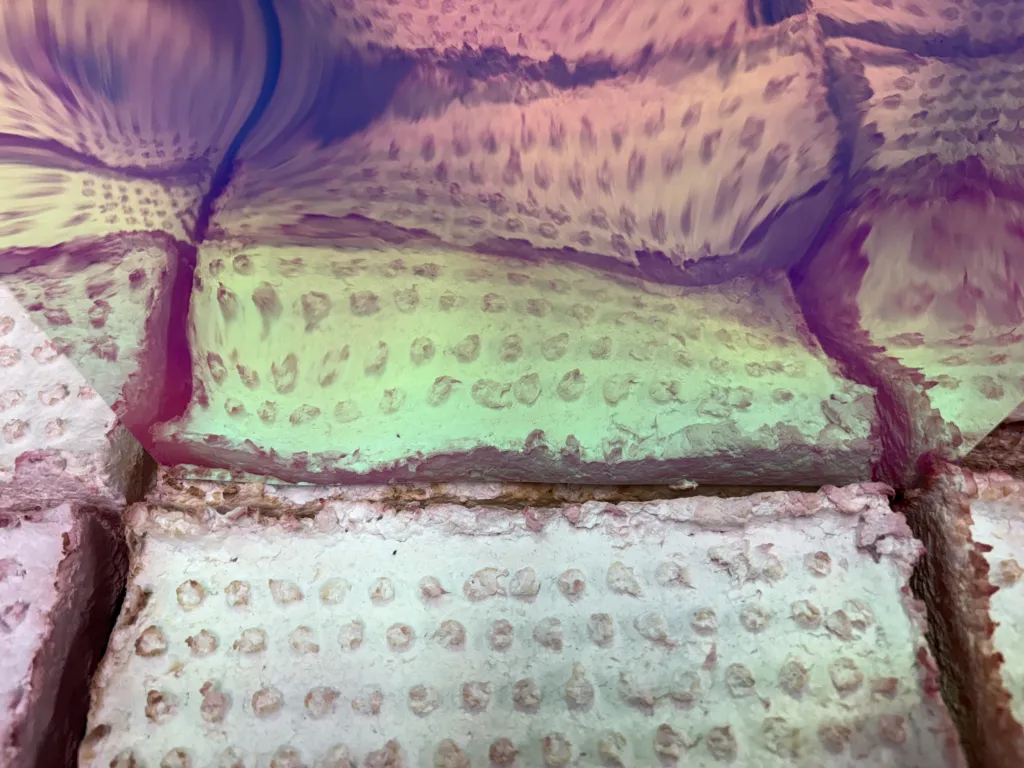 Detail: Bend me, break me, Breaking down is easy, 2024, Paper, wax, pastel, graphite, paper cast bricks & Polaroid 150 x 100 x 20 cm. Image: Courtesy of the artist